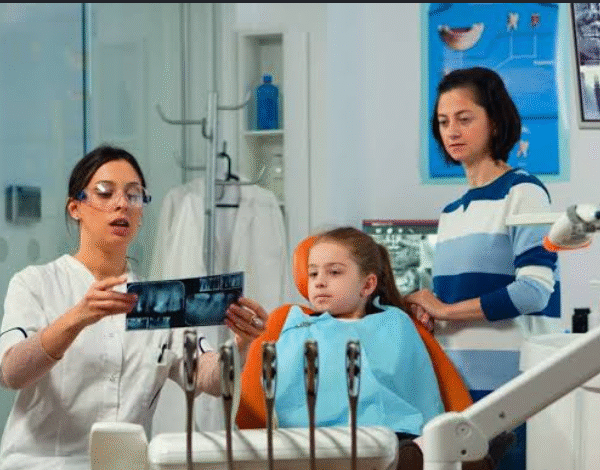 How Family Dentists Monitor Oral Health Before Cosmetic Or Implant Treatment